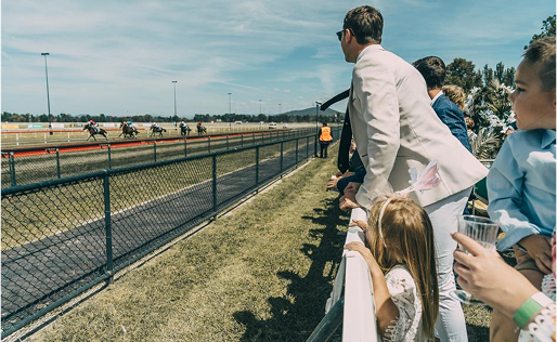 Spectators along the fence